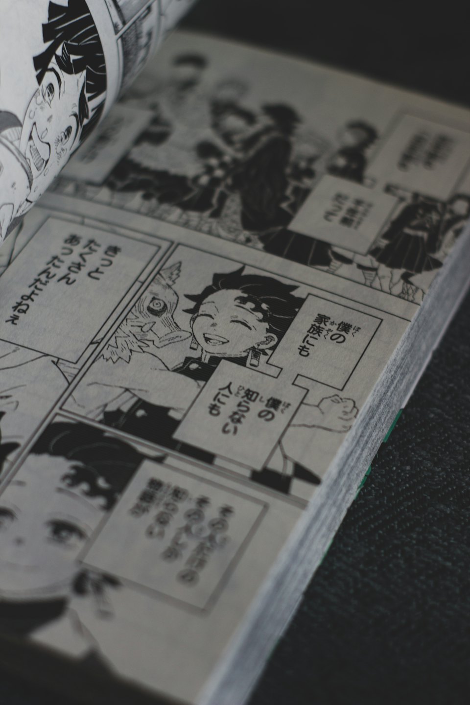 Open manga book with Japanese text and illustrations.